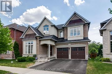 Burlington (Alton) apartment for rent - A house with a brick facade and a large front yard.