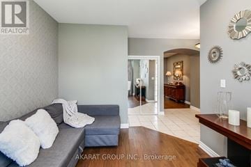 Burlington (Alton) apartment for rent - A living room with a grey couch and a wooden table.