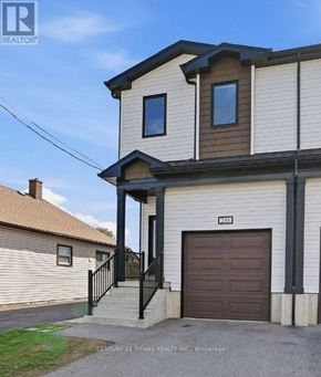 Welland (Lincoln/Crowland) apartment for rent - A two-story house with a garage door and a sign that reads "MS1".