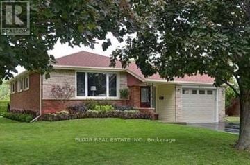 Burlington (Lasalle) apartment for rent - A house with a red roof and a garage door.