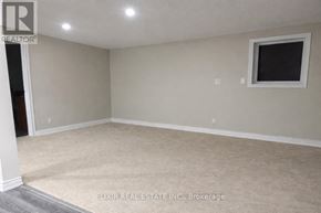 Burlington (Lasalle) apartment for rent - A room with a window and carpeted floor.