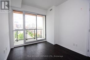 Burlington (Uptown) condo for rent - A room with a view of the city through large windows.