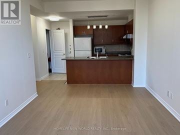 Toronto (Willowdale East) condo for rent - A kitchen with white appliances and wooden cabinets.