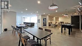 Toronto (Bay Street Corridor) condo for rent - A spacious dining area with a long table and chairs.