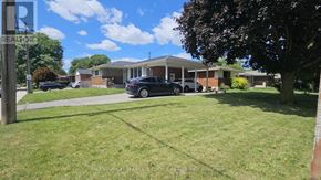 Hamilton (Rolston) apartment for rent - A grassy area with a sign that says REALTOR.