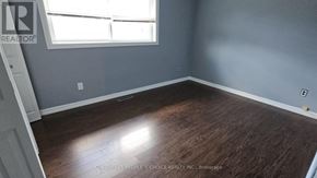 Hamilton (Rolston) apartment for rent - A room with wooden flooring and a window.