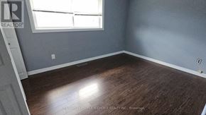 Hamilton (Rolston) apartment for rent - A room with a window and wooden flooring.