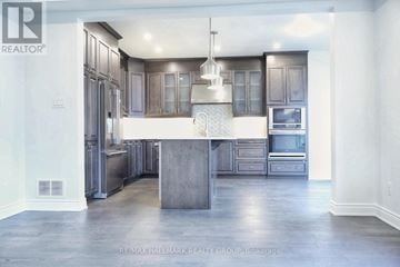 Ottawa apartment for rent - A modern kitchen with a center island and stainless steel appliances.