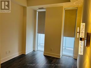 Toronto (Don Valley Village) condo for rent - A room with a sliding glass door leading to a balcony.