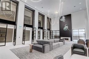 Toronto (Mount Pleasant West) condo for rent - A living room with a view of the city skyline.