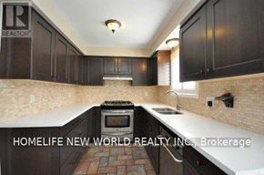 Oshawa (Eastdale) apartment for rent - A kitchen with dark wood cabinets and a brick floor.