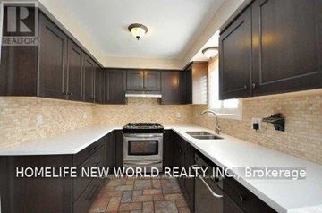 Oshawa (Eastdale) apartment for rent - A kitchen with dark wood cabinets and a brick floor.
