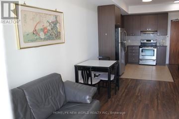 Markham (Unionville) condo for rent - A living room with a grey couch and a framed picture on the wall.