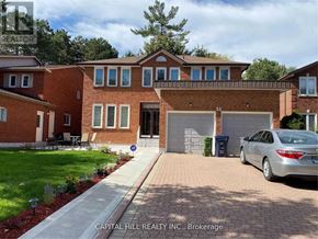 Toronto (Highland Creek) apartment for rent - A house with a brick facade and a garage door numbered 51.