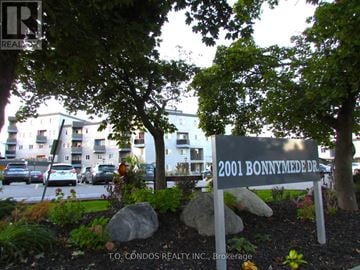 Mississauga (Clarkson) townhouse for rent - A sign for 2001 Bonnymede Dr. is in front of a building.