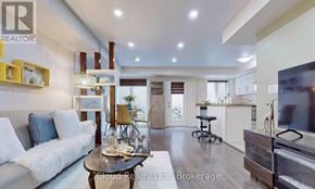 Markham (Cornell) townhouse for rent - A modern living room with a white sofa and a coffee table.