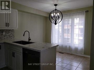 Mississauga (East Credit) townhouse for rent - A kitchen with a sink and a chandelier.
