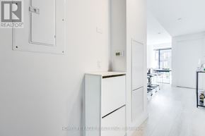 Toronto (Waterfront Communities) condo for rent - A white interior of a room with a door and a shelf.