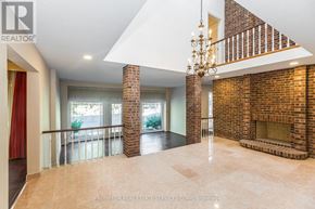 Toronto (Banbury-Don Mills) apartment for rent - A large open space with a chandelier and a brick fireplace.