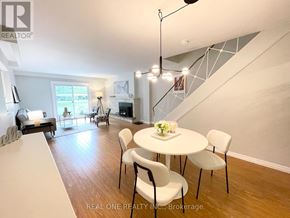 Waterloo townhouse for rent - A dining room with a white table and chairs.