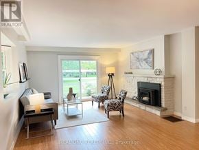 Waterloo townhouse for rent - A living room with a fireplace and a television.