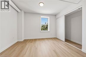 Hamilton apartment for rent - A room with a window and wooden flooring.