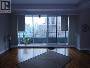 Toronto (Bay Street Corridor) condo for rent - A room with a large window and a view of the city.