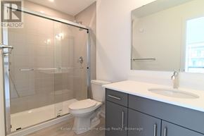 Guelph (Pineridge/Westminster Woods) townhouse for rent - A bathroom with a toilet, sink, and shower.