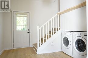 Ramara apartment for rent - A laundry room with a washer and dryer in it.