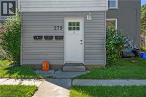 Brantford apartment for rent - A grey house with a white door and number 279 on the wall.
