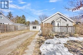 London South (South E) apartment for rent - A house with a fence and a small shed in front of it.