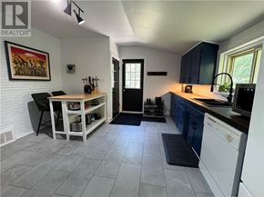 Copper Cliff apartment for rent - A kitchen with a dining table and chairs.