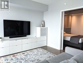 Toronto (Church-Yonge Corridor) condo for rent - A modern living room with a flat screen TV mounted on the wall.