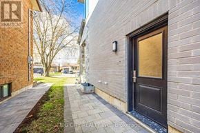 Toronto (Tam O'shanter-Sullivan) apartment for rent - A brick building with a sign that says REALTOR.