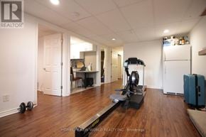 Markham (German Mills) apartment for rent - A room with a treadmill and a vacuum cleaner.