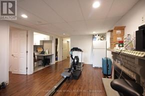 Markham (German Mills) apartment for rent - A room with a treadmill and a suitcase.