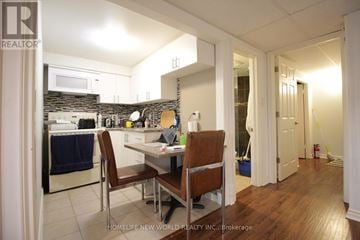 Markham (German Mills) apartment for rent - A kitchen with a table and chairs in the middle of the room.
