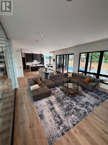 Aurora (Aurora Village) apartment for rent - A modern living room with a large grey sofa and a coffee table.