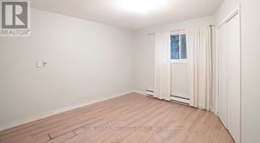London North (North N) fourplex for rent - A room with a window and a door.