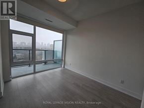 Toronto (Bayview Village) condo for rent - A room with a view of the city through large windows.
