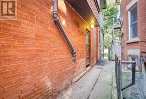 Toronto (Annex) apartment for rent - A red brick building with a sign that says REALTOR.