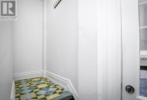 Toronto (Annex) apartment for rent - A hallway with a tiled floor and a door on the right.