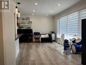 Toronto (Tam O'shanter-Sullivan) apartment for rent - A living room with a drum set on the floor.