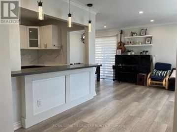 Toronto (Tam O'shanter-Sullivan) apartment for rent - A well-lit kitchen with a bar area and a piano.