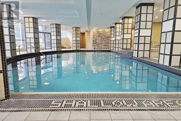 Markham (Unionville) condo for rent - A large indoor swimming pool with a tiled floor.