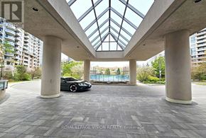 Markham (Unionville) condo for rent - A car is parked in a covered parking area.