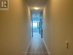 Vaughan (Concord) condo for rent - A long hallway with a door at the end.