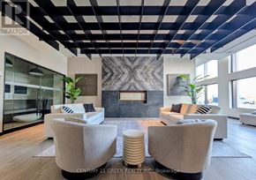 Milton (Co Coates) condo for rent - A modern living room with a fireplace and two couches.