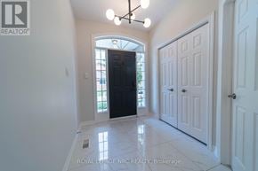 Niagara Falls (Morrison) townhouse for rent - A white hallway with a black door and a white door on the right.