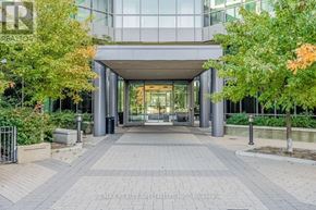 Toronto (Islington-City Centre West) condo for rent - The entrance to a building with glass doors and a brick walkway.